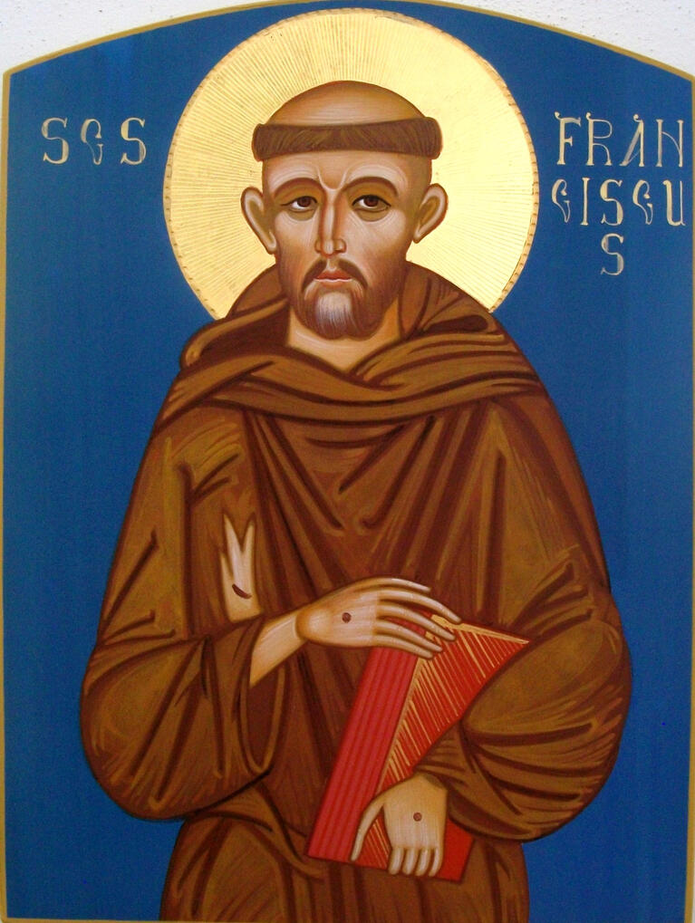 San Francesco "Icona bizantina di San Francesco d'Assisi dipinta a mano dal maestro iconografo Nicola Damiano. Il Santo è raffigurato in saio francescano marrone cinto da un cordone con tre nodi, mentre mostra i segni delle stimmate sulle mani e regge una croce [o un li